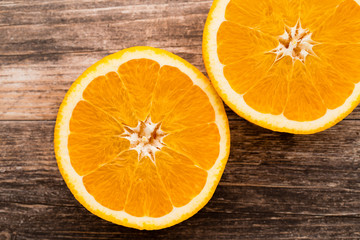 Orange slice on the grey  background.