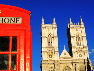Fototapeta na wymiar Traditional red London phone box and Westminster Abbey, England, UK