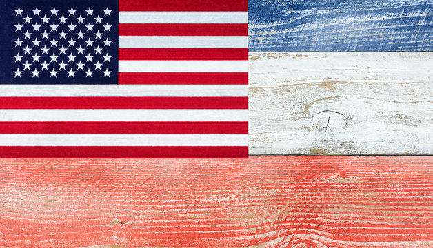 American flag with national colors painted on fading wood