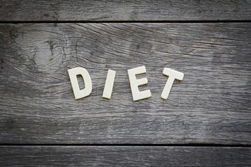 The word diet on the wooden floor