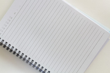 Blank notebook on white paper background