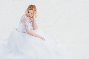 Fototapeta na wymiar Young and beautiful bride in winter