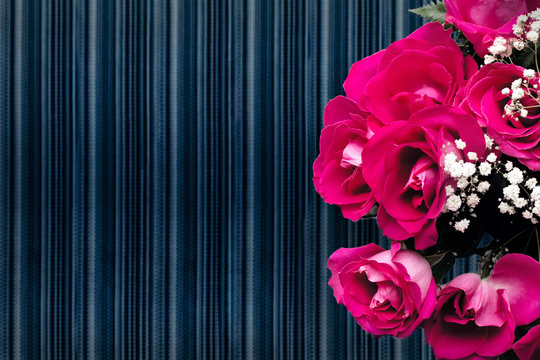 Pink bouquet of roses with dark striped background