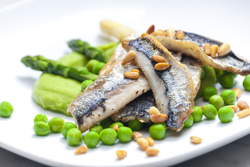 herring with green asparagus and peas