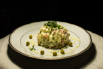 serving of salad on a black background