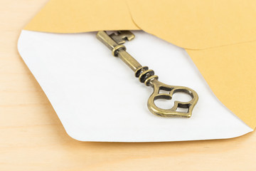 Antique key in envelope