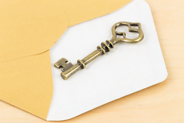 Antique key in envelope