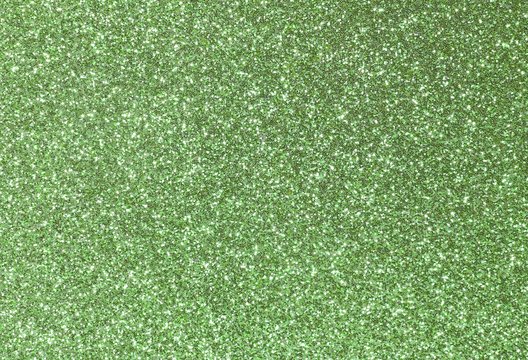 background shining uniformly colored green glitter