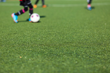 Blurred kids playing soccer
