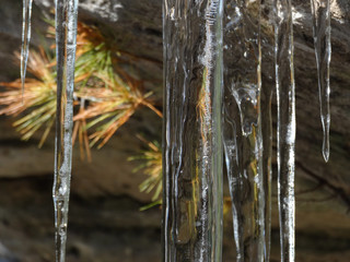 Icicles hang from the stone roof
