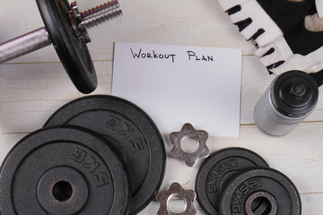 Fitness background. Workout plan, dumbbells. Copy space image