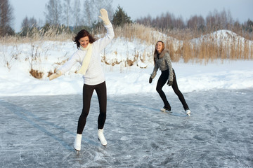 young Figure skating women at the frozen lake in the winter