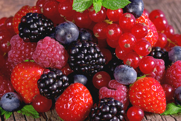 Fresh berries with mint leaves