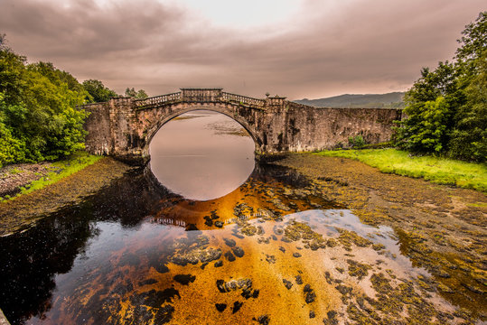 Fototapeta Disused bridge at the head of Loch Shira Loch Fyne