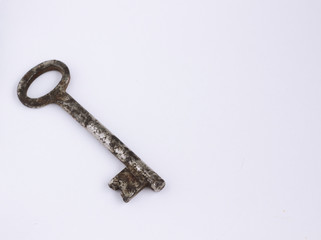 old rusty key on white background