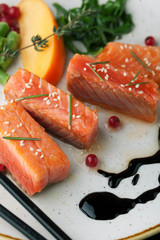 Fresh salmon with spices, herbs, rosemary and sesame seeds