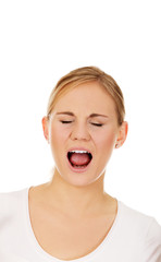 Stressed or angry young woman screaming