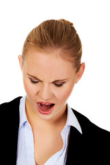 Angry young business woman screaming 