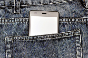 Mobile phone, cellphone in back pocket blue jeans