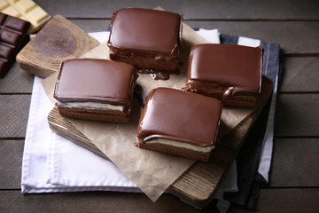 Delicious chocolate brownies on wooden background