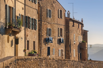 Fototapeta na wymiar Medieval Walls of Pienza. Pienza is the medieval Italian village in Tuscany. In 1996, UNESCO declared the town a World Heritage Site