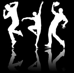 Silhouettes of dancers in dancing concept