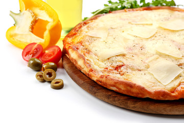 Full of cheese pizza on wooden board with vegetables, close up
