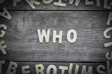 The word who on the wooden floor