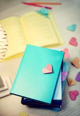 Heart bookmarks for books on wooden table closeup