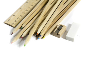 pencil, eraser, sharpener, wood meter on white background