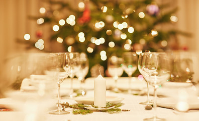 Closeup of a candle decoration and Chritmas table setting