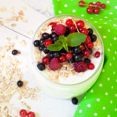 yogurt with berries and oat flakes