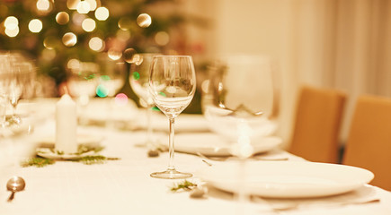Table setting at Christmas with lights in the background