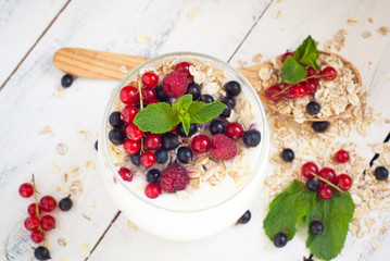 yogurt with berries and oat flakes
