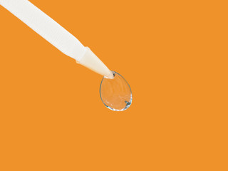 Contact lens on an orange background