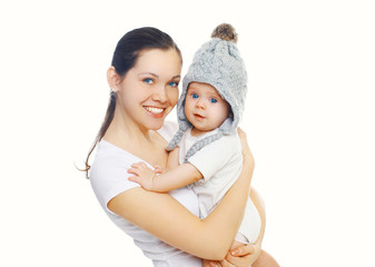 Happy smiling mother and baby over white background