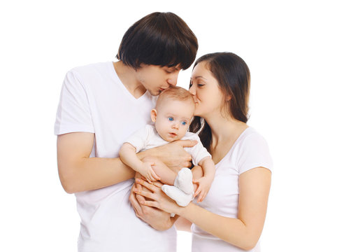 Happy young family, mother and father kissing baby on white back