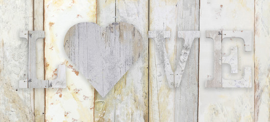 love text with heart shape on wood planks grunge texture background