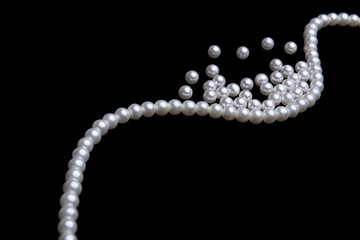 beautiful pearls on black background