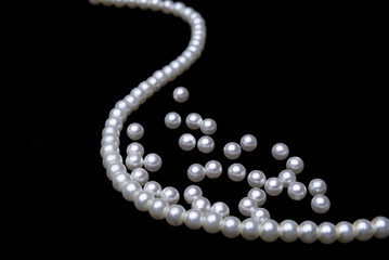 beautiful pearls on black background