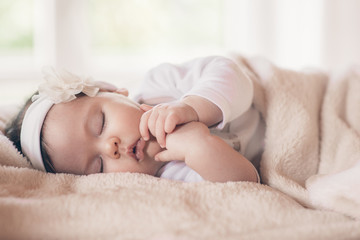 Obraz na płótnie Canvas Close-up portrait beautiful sleeping baby