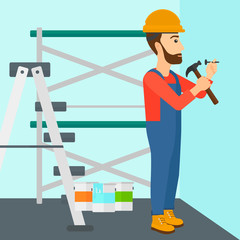 Fototapeta premium Constructor hammering nail.
