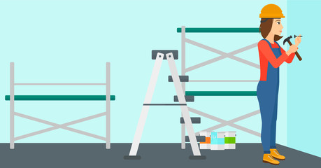 Constructor hammering nail.