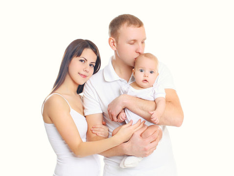 Happy young family, mother and father with little baby on a whit