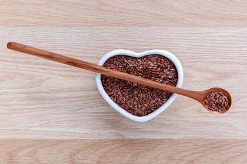 Alternative health care and dieting flax seeds in wooden spoon s
