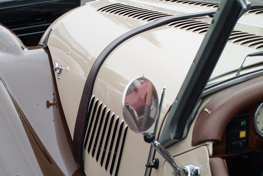 White vintage car with mirror