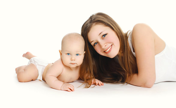 Happy young smiling mother and baby together on white background