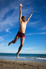 Obraz premium Saut à la plage