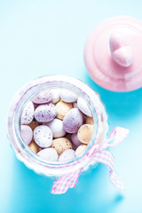 Vibrant chocolate easter eggs in pastel colors