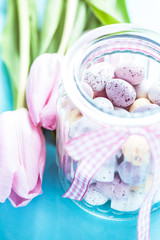 Vibrant chocolate easter eggs in pastel colors